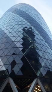 The many reflections on the Gherkins glass facade. .